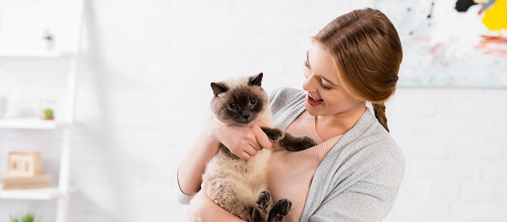 A woman with an emotional support cat